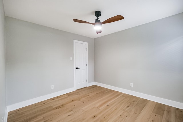 spare room featuring wood-type flooring and ceiling fan