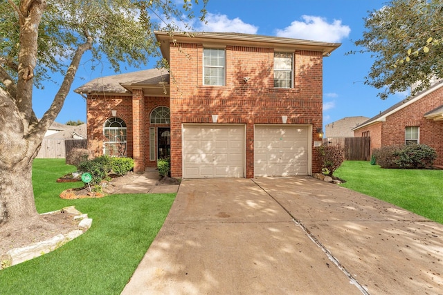 view of front of property featuring a garage and a front lawn