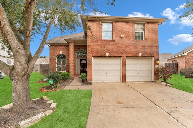 view of front of home with a garage and a front yard