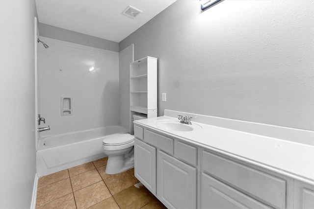 full bathroom featuring vanity, tile patterned floors, toilet, and washtub / shower combination