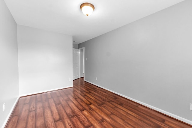 empty room featuring dark hardwood / wood-style floors