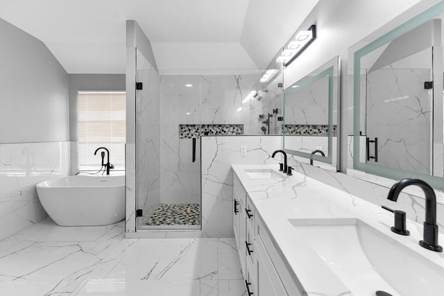 bathroom with plus walk in shower, lofted ceiling, tile walls, and vanity