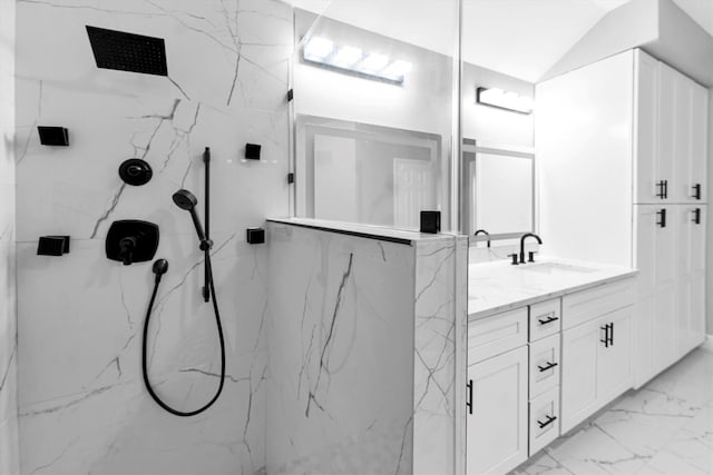 bathroom featuring vanity and a tile shower