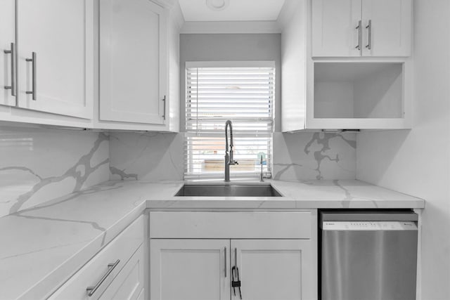 kitchen featuring white cabinetry, stainless steel dishwasher, light stone countertops, and sink