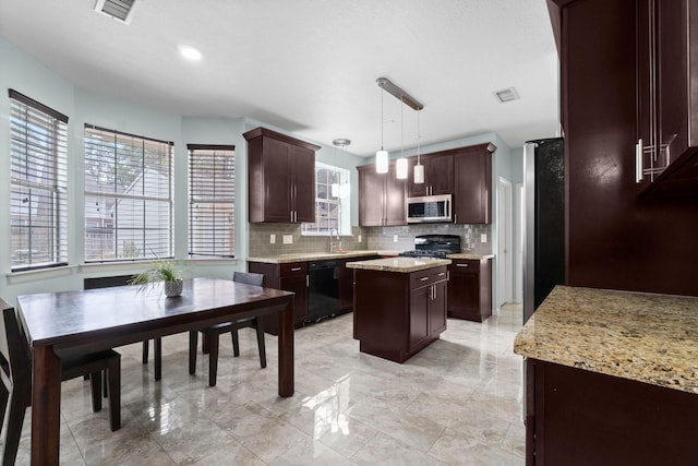 kitchen with sink, range, dishwasher, a kitchen island, and pendant lighting