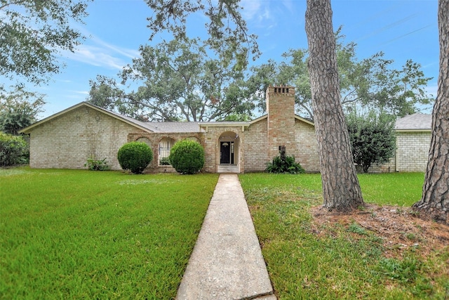 ranch-style house featuring a front lawn