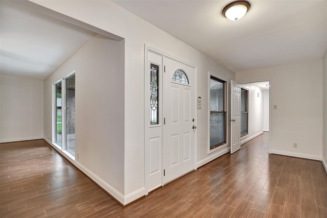 entryway featuring a healthy amount of sunlight and dark hardwood / wood-style floors