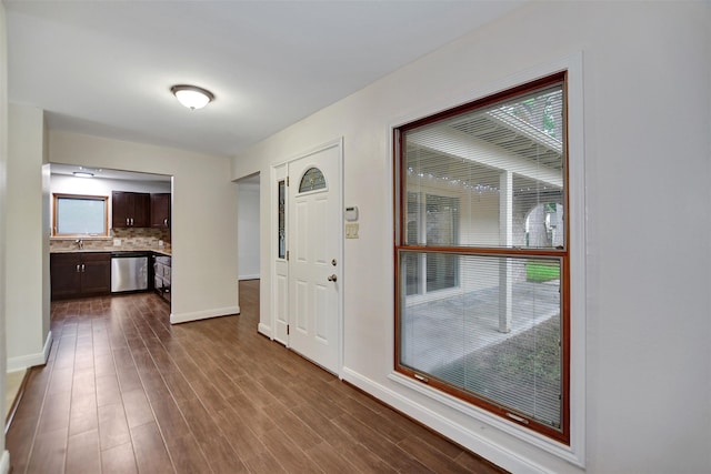 entryway with sink and hardwood / wood-style floors