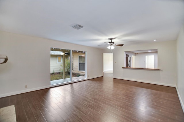 unfurnished living room featuring hardwood / wood-style floors and ceiling fan