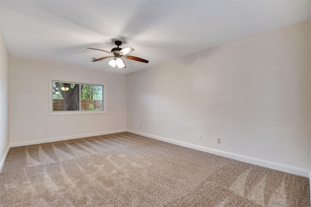 spare room with ceiling fan and carpet flooring