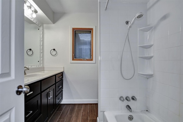 bathroom with vanity and tiled shower / bath