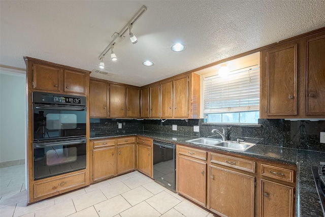 kitchen with light tile patterned flooring, sink, decorative backsplash, and black appliances