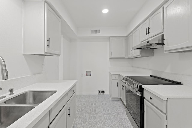 kitchen featuring white cabinetry, sink, and electric stove