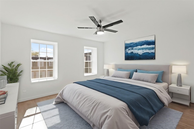 bedroom featuring ceiling fan and hardwood / wood-style floors