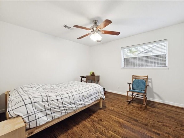 bedroom featuring ceiling fan and dark hardwood / wood-style floors