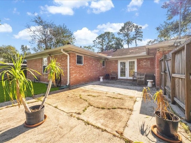 rear view of property featuring a patio and french doors