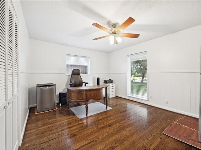 office space with ceiling fan and dark hardwood / wood-style flooring