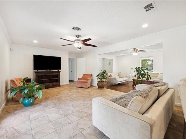 living room with crown molding and ceiling fan