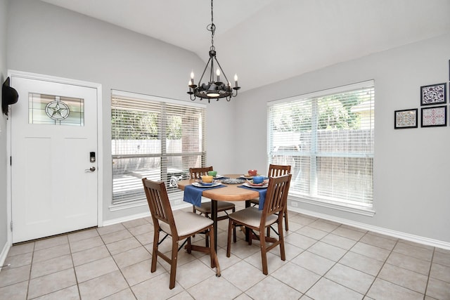 dining space featuring light tile patterned flooring, lofted ceiling, and plenty of natural light