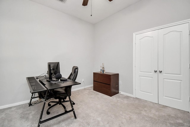 office space with light carpet and ceiling fan