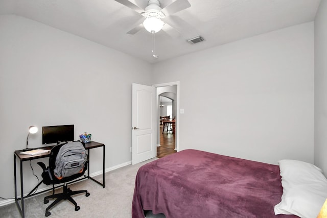 bedroom with ceiling fan and light carpet