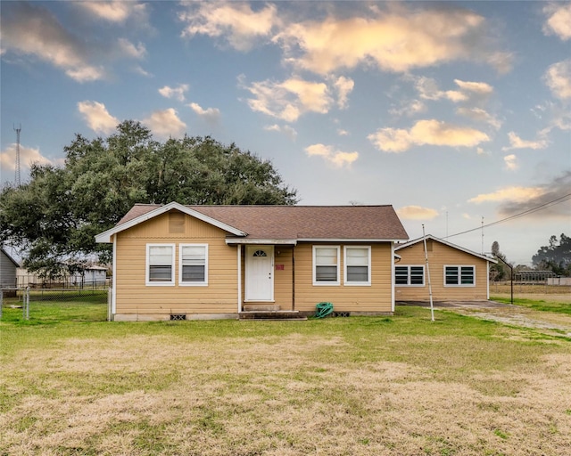 ranch-style home with a front yard