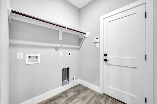 clothes washing area with gas dryer hookup, washer hookup, hookup for an electric dryer, and light wood-type flooring