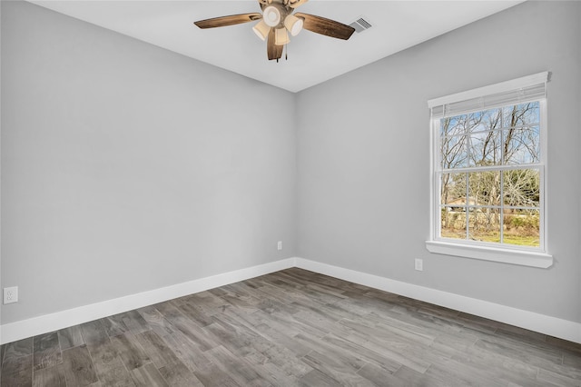 unfurnished room featuring hardwood / wood-style flooring and ceiling fan