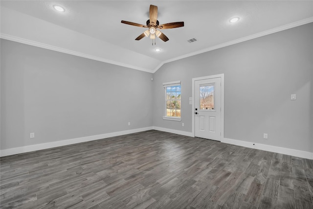 empty room with hardwood / wood-style flooring, vaulted ceiling, ceiling fan, and crown molding