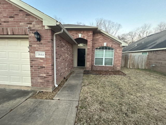 view of exterior entry with a garage