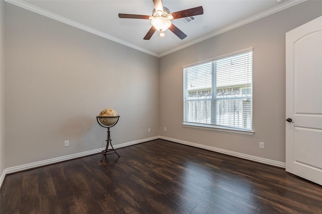 spare room with ornamental molding, dark hardwood / wood-style floors, and ceiling fan