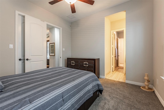 carpeted bedroom with connected bathroom and ceiling fan