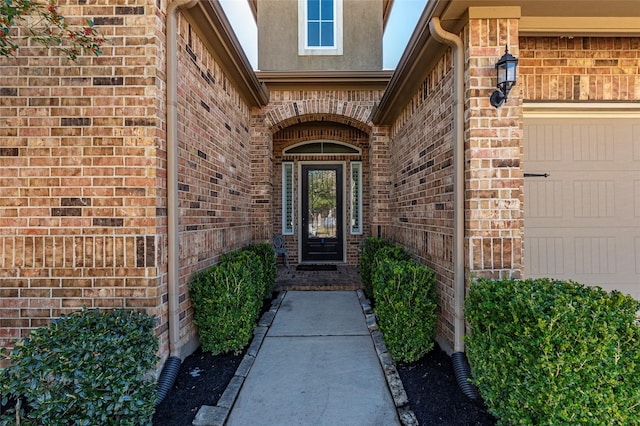 property entrance with a garage