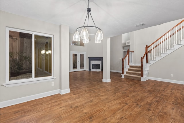 unfurnished living room with wood-type flooring