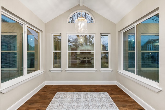 unfurnished sunroom featuring an inviting chandelier and lofted ceiling