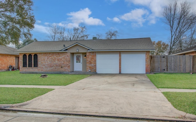 single story home featuring a garage and a front yard