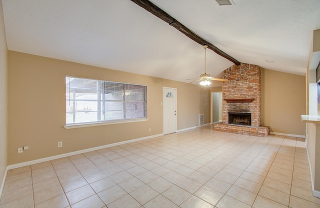 unfurnished living room with lofted ceiling with beams, ceiling fan, light tile patterned floors, and a fireplace