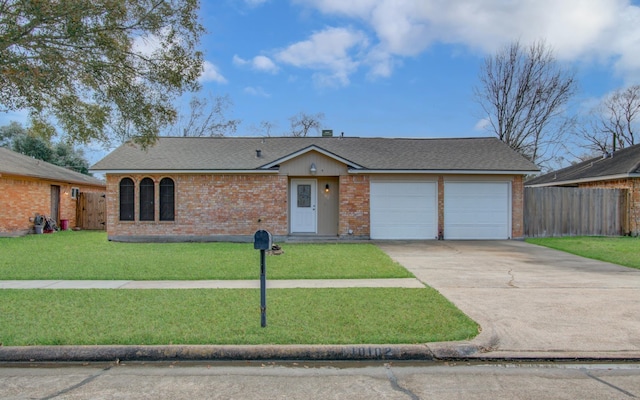 ranch-style home with a garage and a front yard