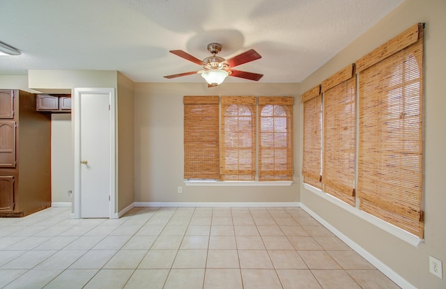 interior space with ceiling fan