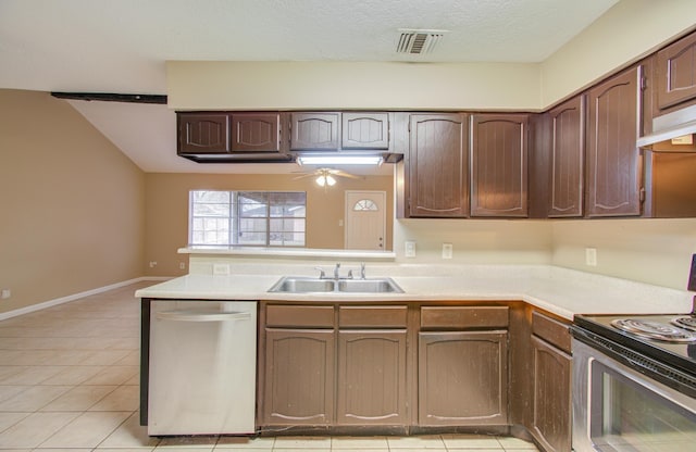 kitchen with sink, light tile patterned floors, ceiling fan, appliances with stainless steel finishes, and dark brown cabinetry