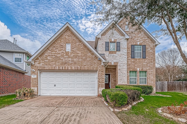 traditional home featuring a garage, fence, concrete driveway, and brick siding