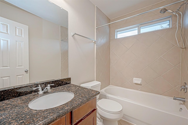 full bathroom featuring vanity, tiled shower / bath combo, and toilet