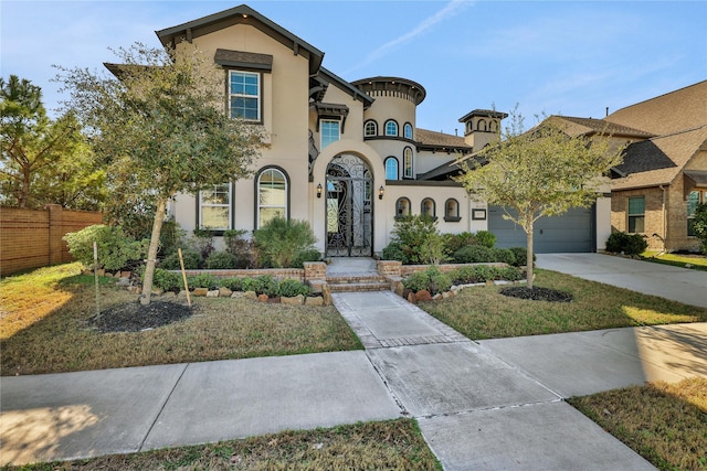 view of front of property with a garage and a front yard