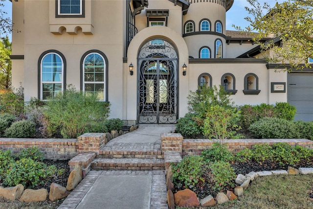 view of exterior entry with a garage