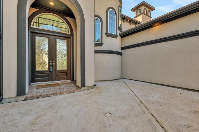 property entrance featuring french doors