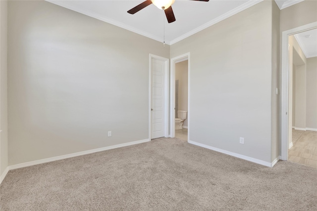 empty room with ceiling fan, ornamental molding, and carpet flooring