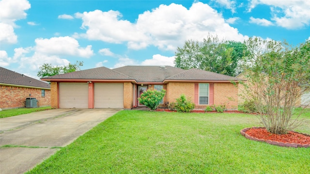 ranch-style home featuring a garage, central AC, and a front lawn