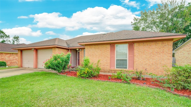 view of front of property featuring a garage and a front yard