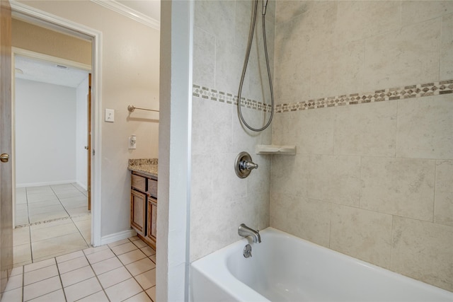 bathroom featuring vanity, tiled shower / bath combo, tile patterned floors, and crown molding