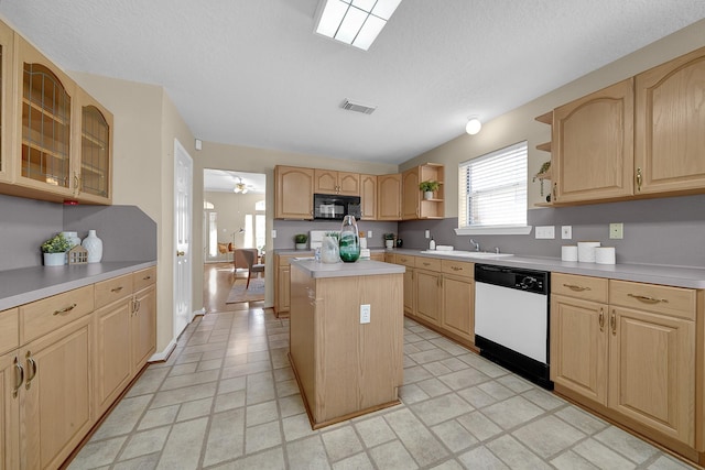 kitchen with white dishwasher, a center island, a textured ceiling, and light brown cabinets